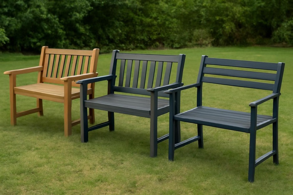Three garden benches made from teak, recycled plastic, and powder-coated steel placed on lawn